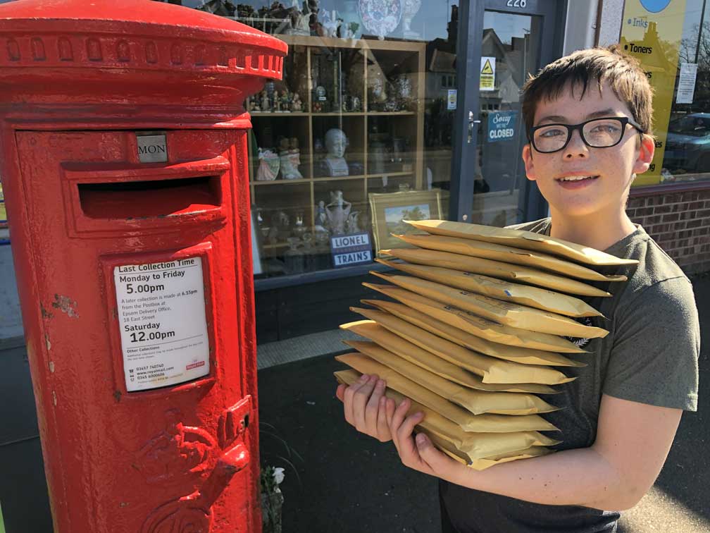 Oliver with packages to post